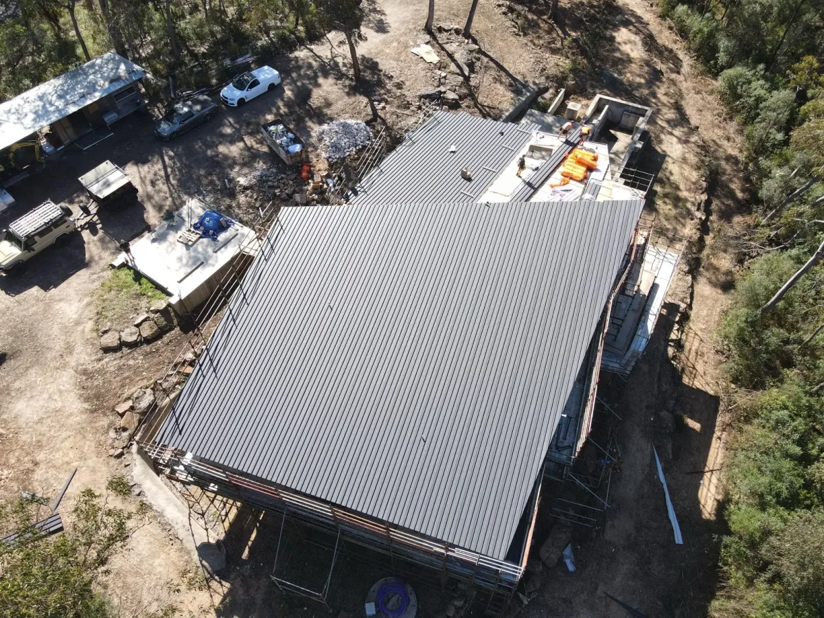 Aerial view of metal roofing during construction, from the Nexus work collection